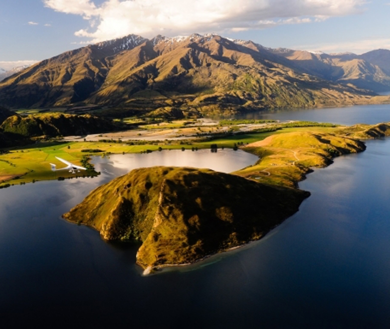 mountain-flying-over-paddock-bay-lake-wanaka